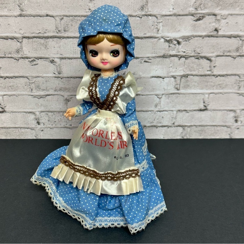 Vintage 1983 New Orleans World's Fair Big Eyes Doll Dress Bonnet Stand 10 in.